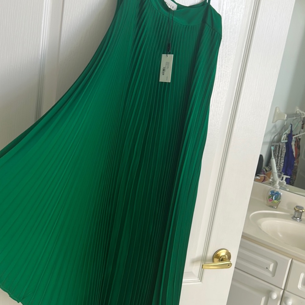 Emerald green pleated asymmetrical dress. Flowing